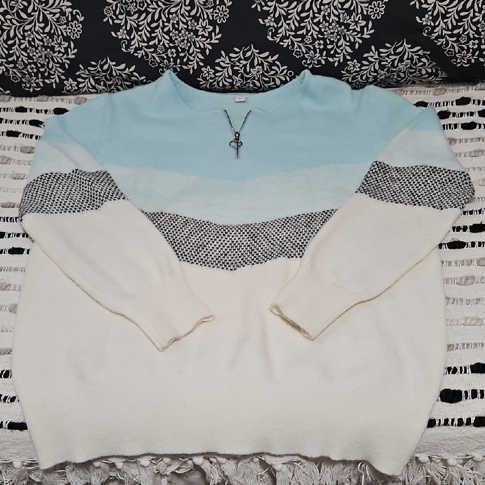 Blue and White Sweater with Black Pattern